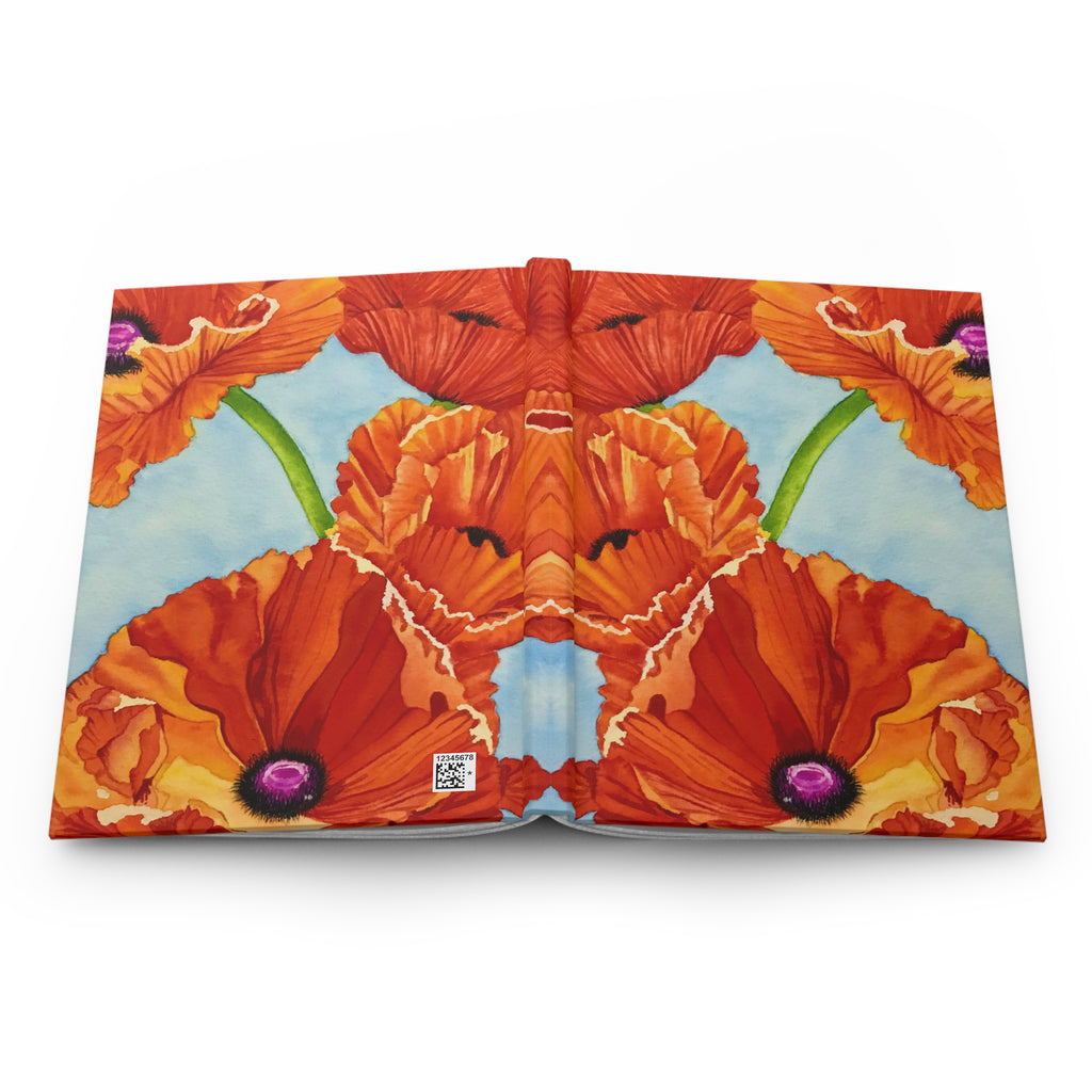 Journal opened to display the wrapped red-orange poppy artwork across the back cover, spine, and front cover.